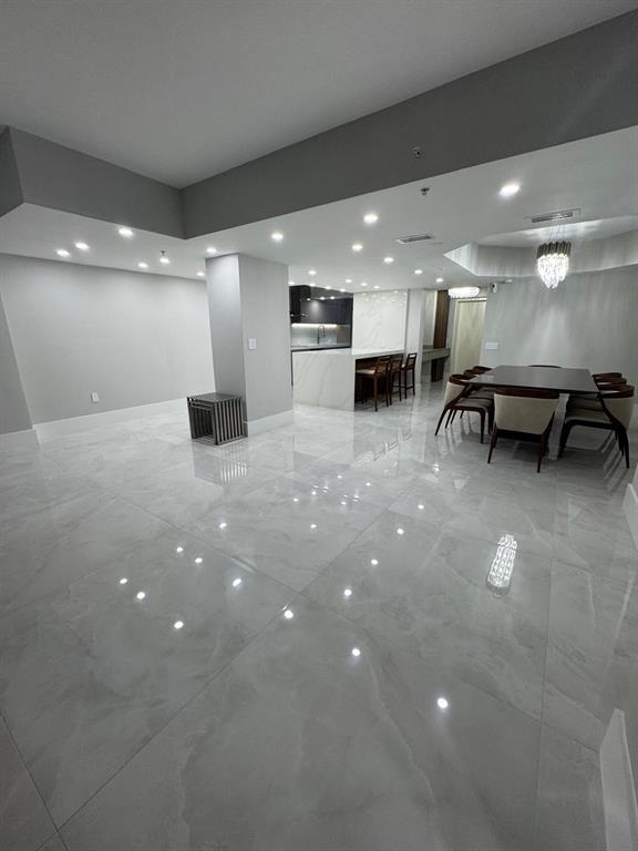 2051 Southeast 3rd Street, Unit 406 Deerfield Beach, FL 33441 - Photo 45 of 61 a view of a big room with air conditioner and window