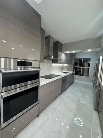 a kitchen with a table and chairs in it