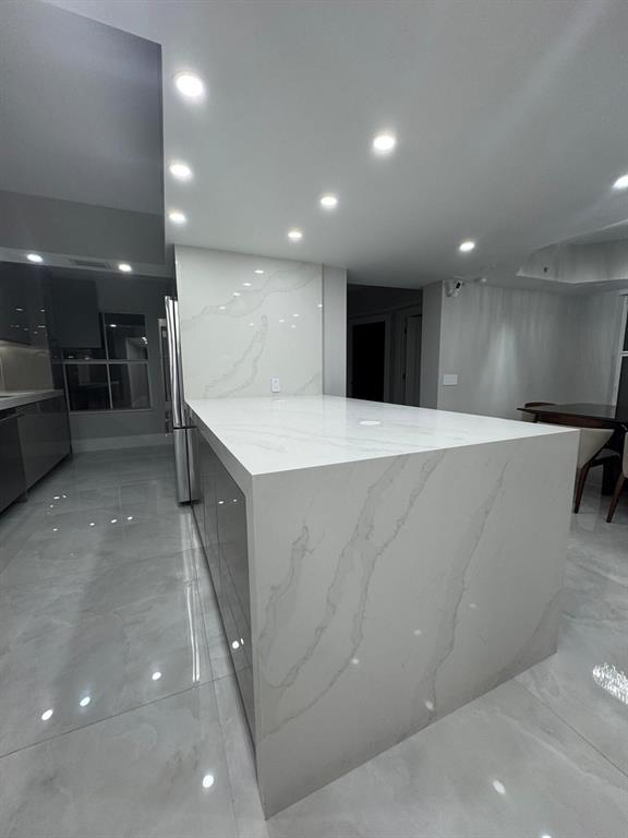 2051 Southeast 3rd Street, Unit 406 Deerfield Beach, FL 33441 - Photo 6 of 61 a large room with lot of cabinets