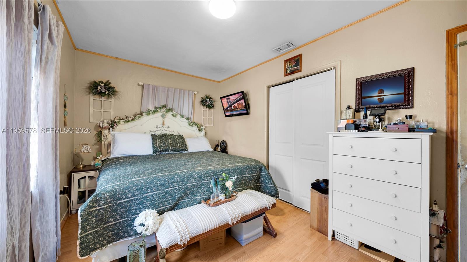 360 West 55th Street Hialeah, FL 33012 - Photo 12 of 20 a living room with furniture and a flat screen tv