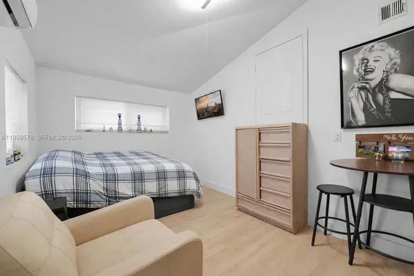 a bedroom with furniture and a bed