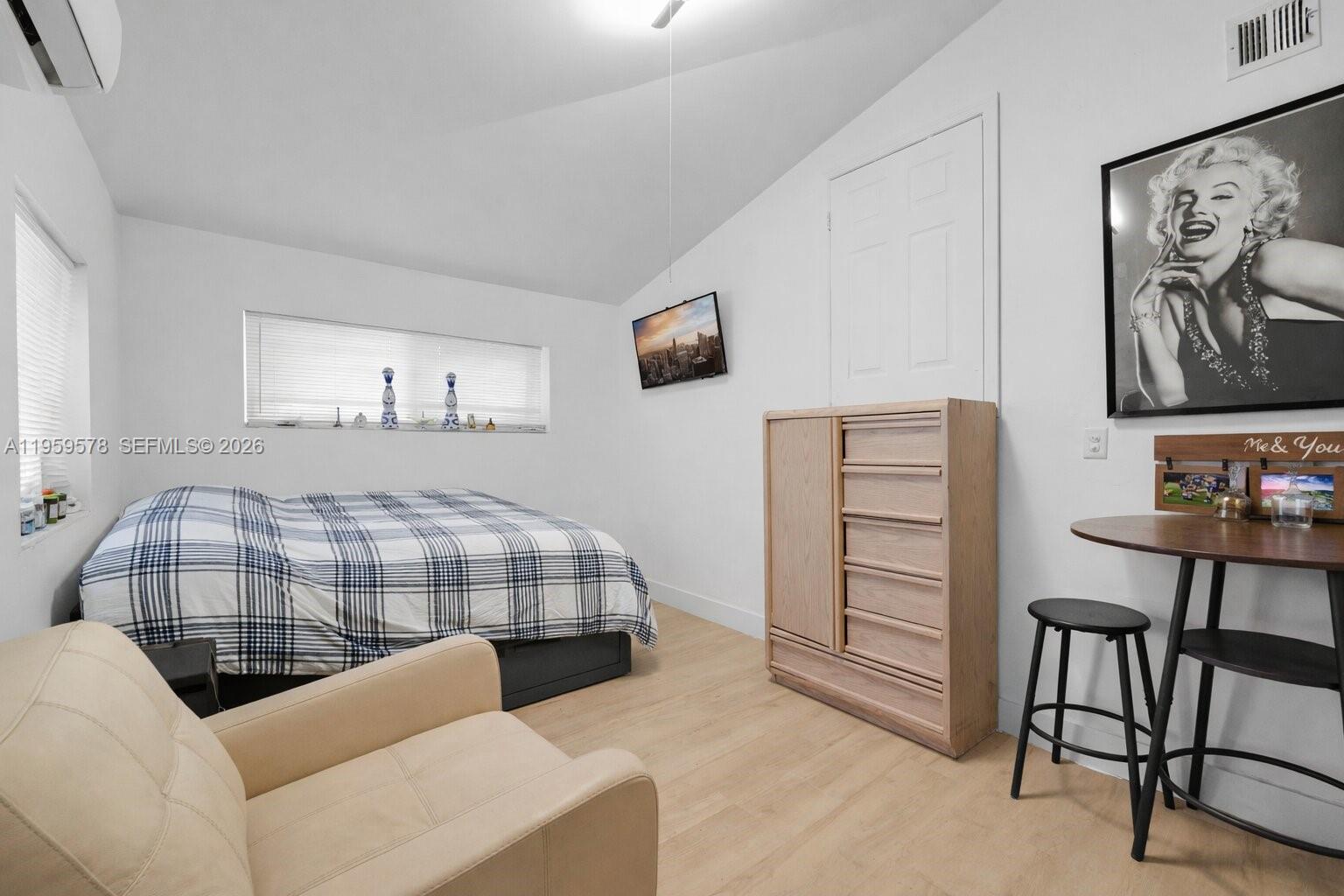 360 West 55th Street Hialeah, FL 33012 - Photo 17 of 20 a bedroom with furniture and a bed