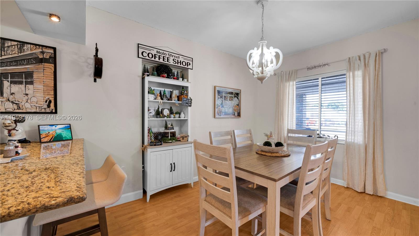 360 West 55th Street Hialeah, FL 33012 - Photo 9 of 20 a view of a dining room with furniture window and wooden floor