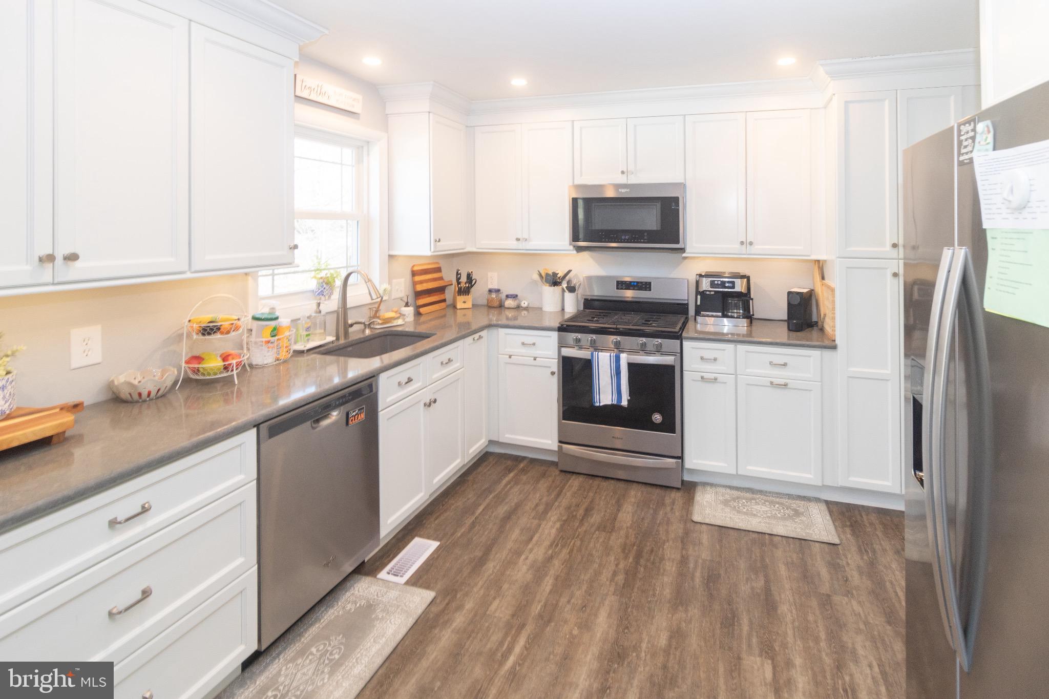 70 Tarnsfield Road Westampton, NJ 08060 - Photo 11 of 35 Modern kitchen with sleek white cabinetry.