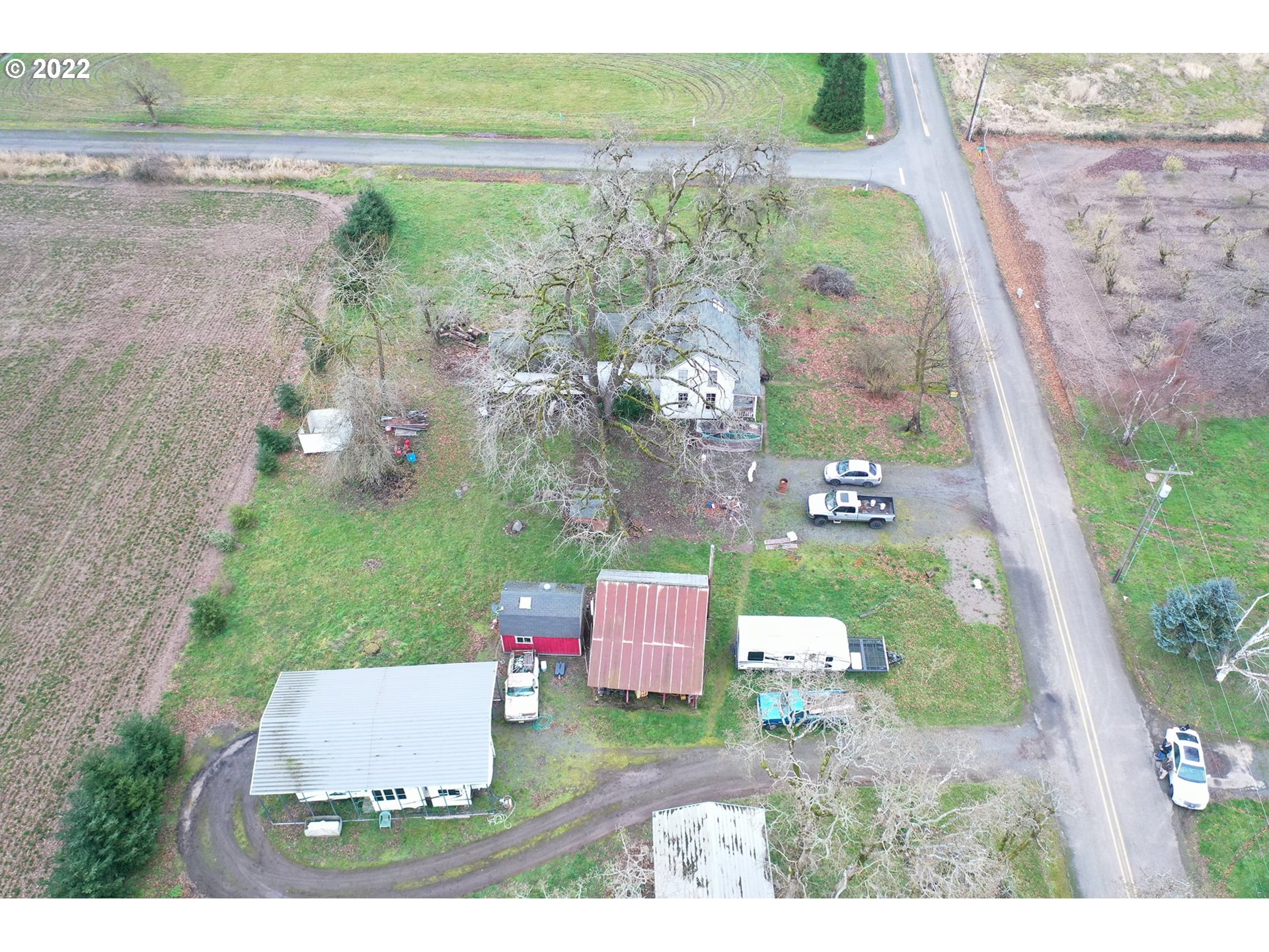 11713 South Riggs Damm Road Canby, OR 97013 - Photo 3 of 28 an aerial view of a house with a yard and lake view