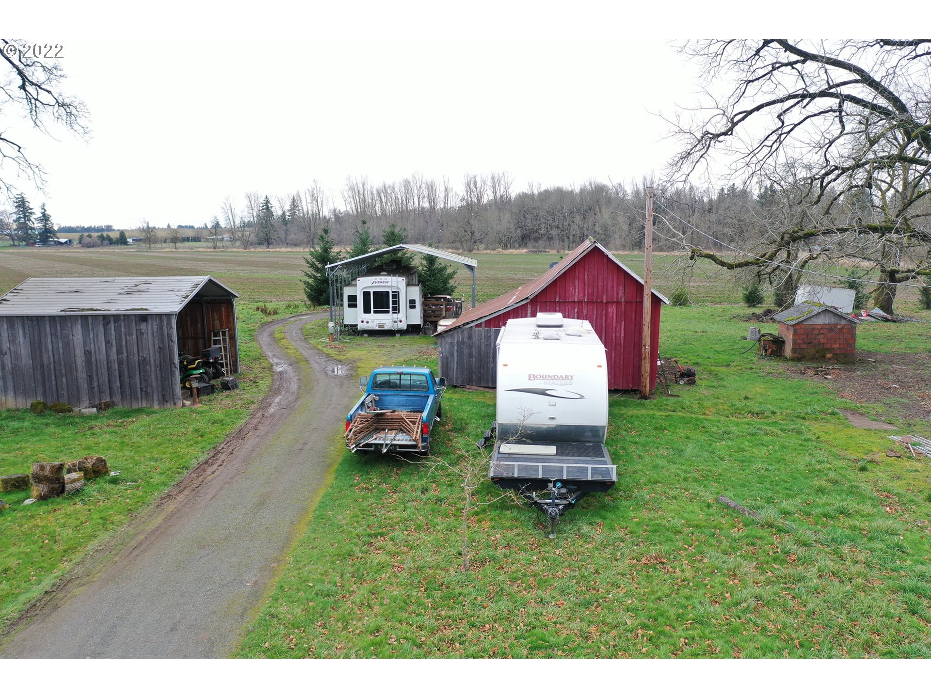 11713 South Riggs Damm Road Canby, OR 97013 - Photo 9 of 28 a aerial view of a house with table and chairs in the patio