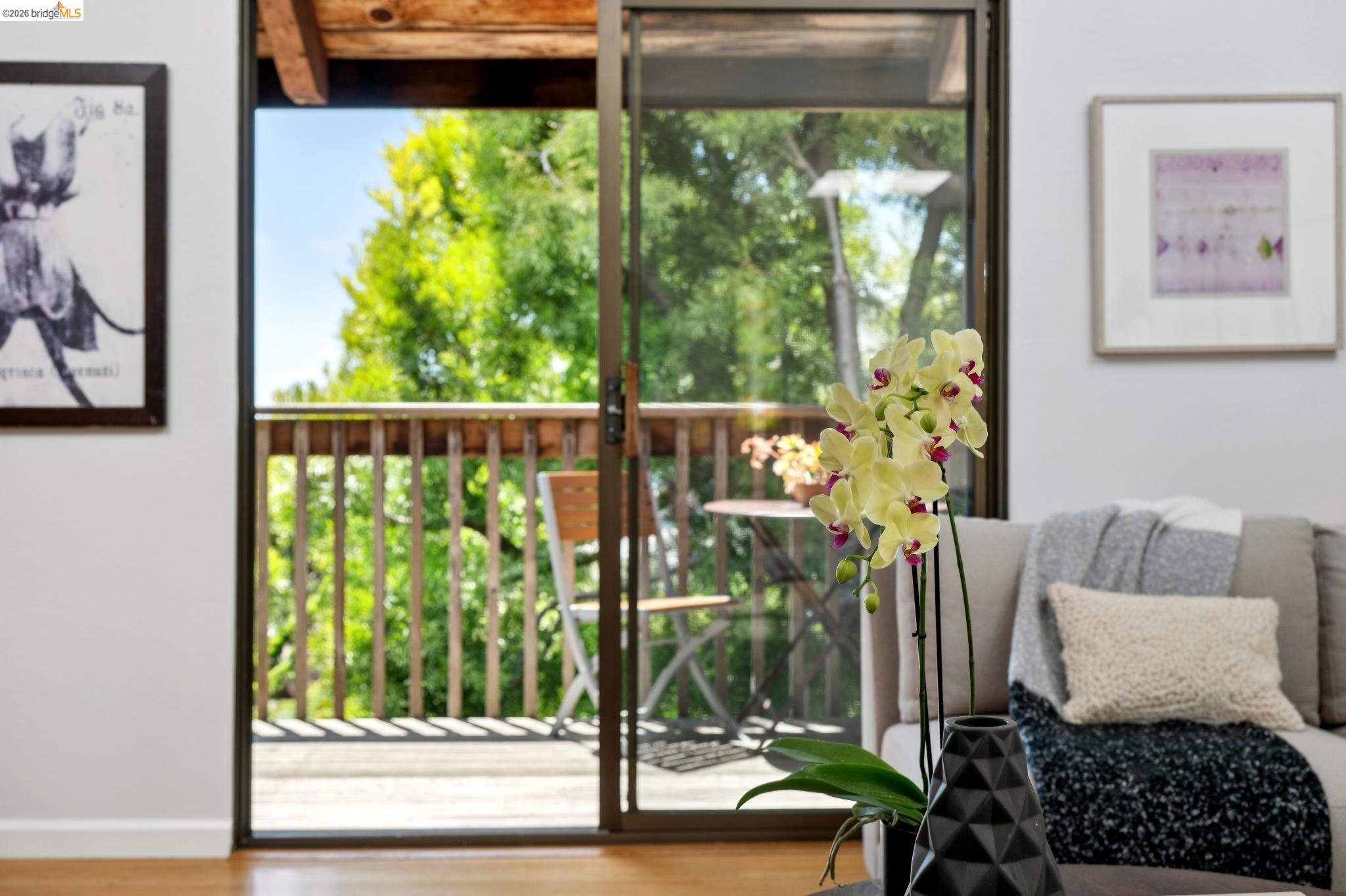 1340 Henry Street Berkeley, CA 94709 - Photo 8 of 52 Sliding glass door opening to an exterior wood-finish deck with wood-slat railings
