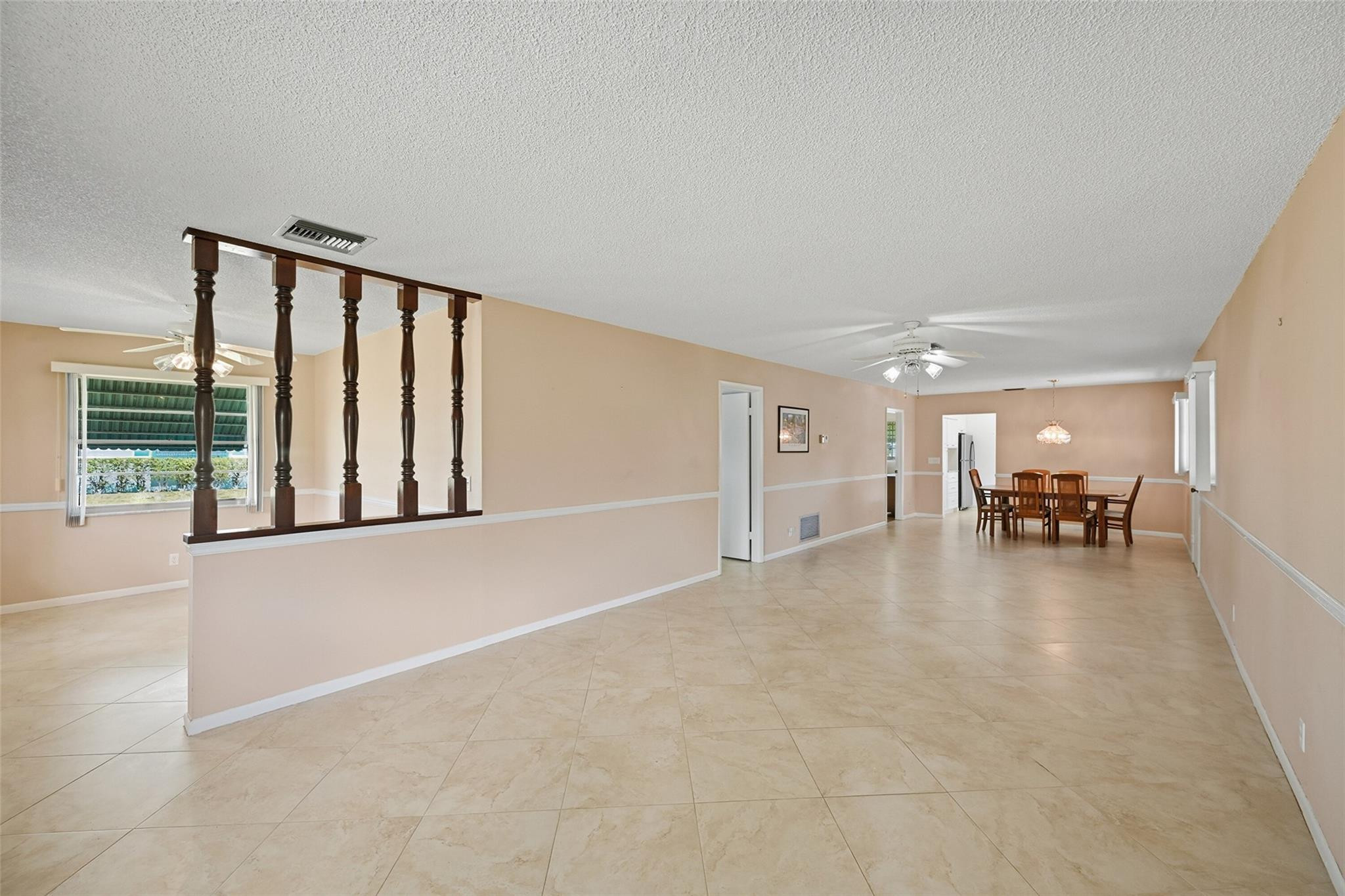 602 Hummingbird Lane, Unit 602 Delray Beach, FL 33445 - Photo 11 of 31 a view of livingroom with furniture and floor to ceiling window