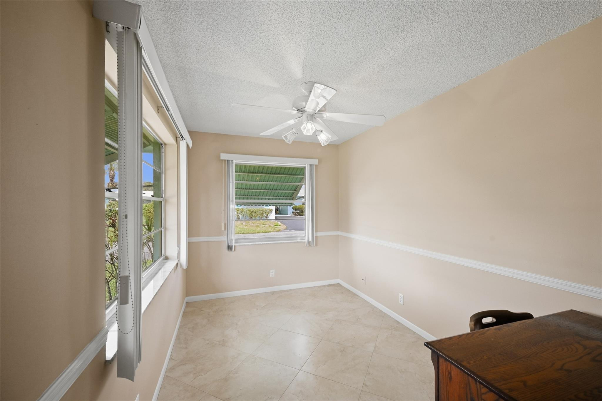 602 Hummingbird Lane, Unit 602 Delray Beach, FL 33445 - Photo 13 of 31 a view of an empty room with a window