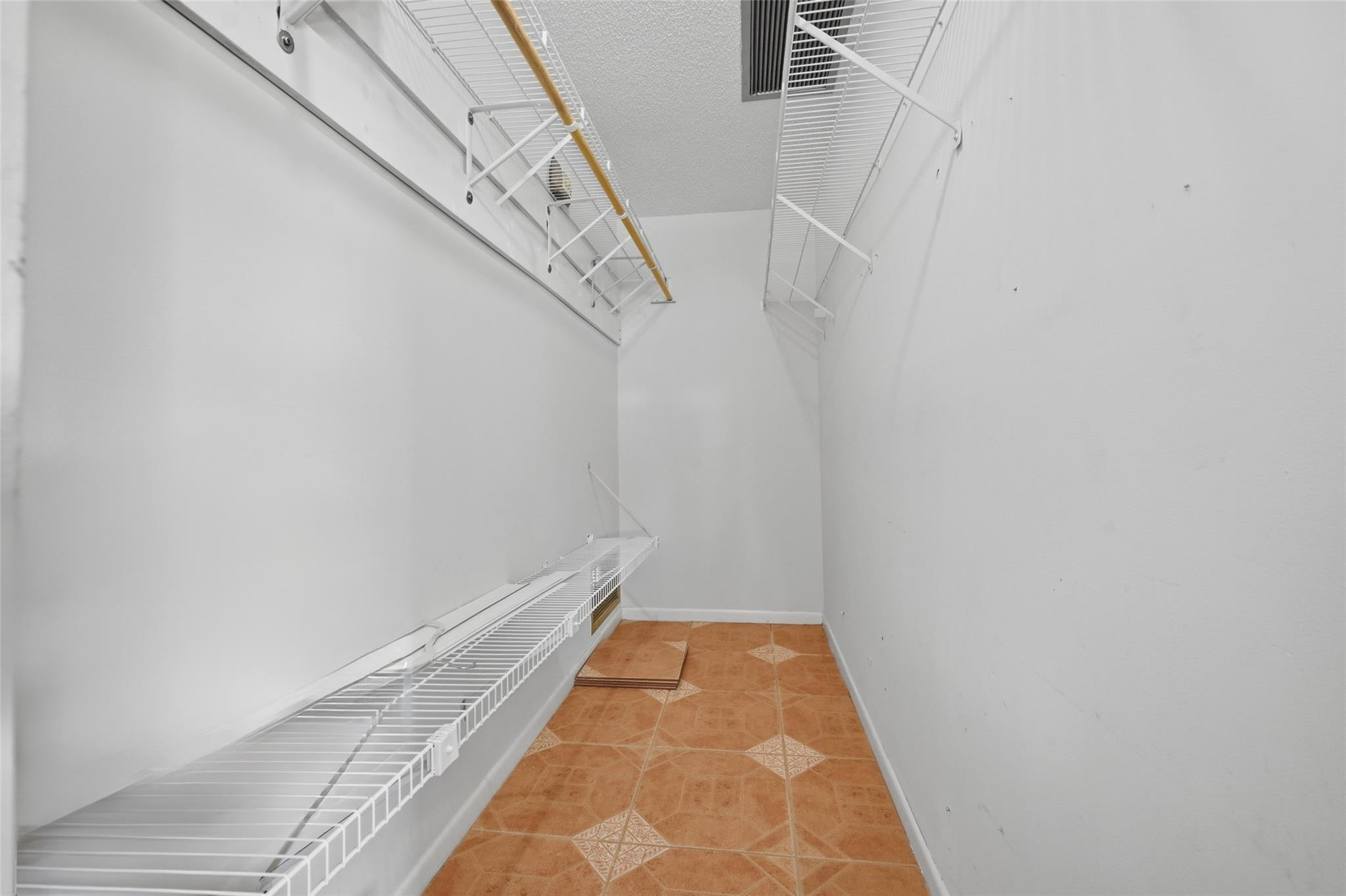 602 Hummingbird Lane, Unit 602 Delray Beach, FL 33445 - Photo 24 of 31 a view of small space with racks on the wall