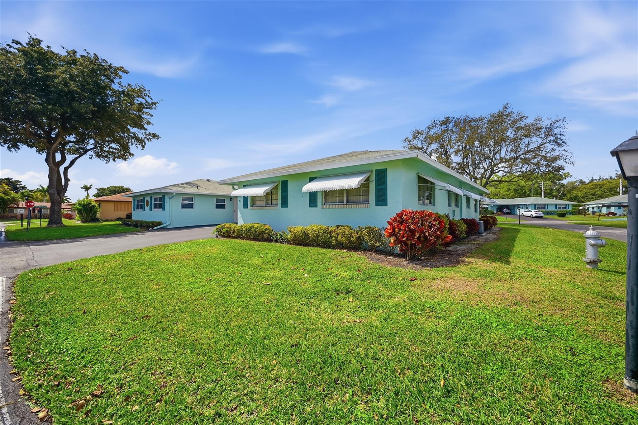 602 Hummingbird Lane, Unit 602 Delray Beach, FL 33445 - Photo 3 of 31 a front view of a house with garden