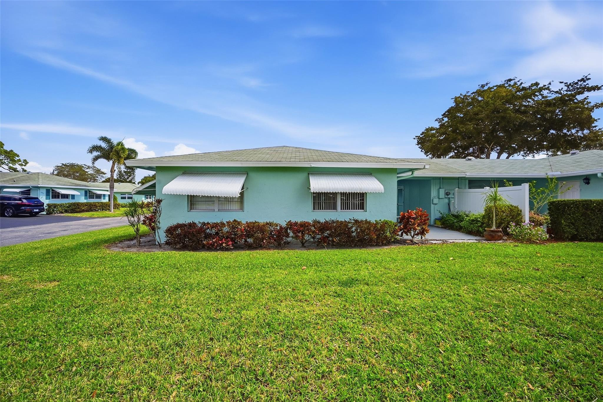 602 Hummingbird Lane, Unit 602 Delray Beach, FL 33445 - Photo 5 of 31 a view of a house with a backyard