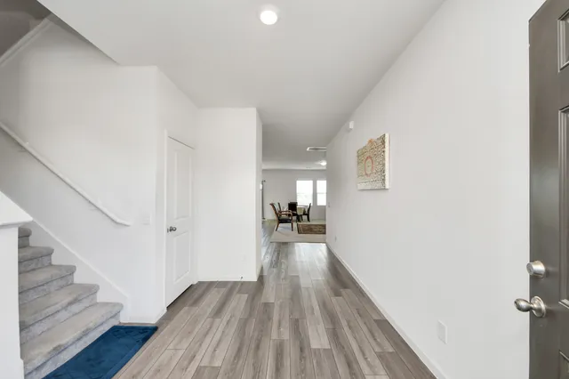 a view of entryway with wooden floor