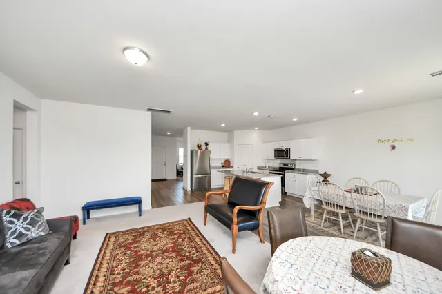 a living room with furniture and a table