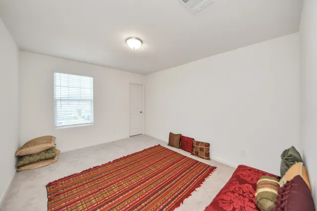 a bedroom with a bed and a table in it