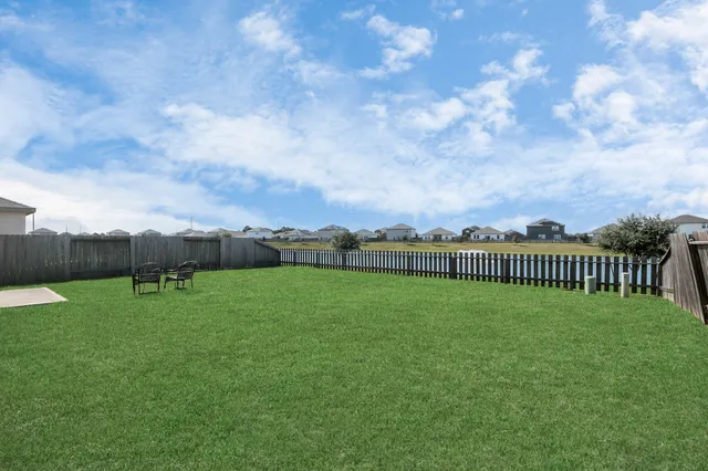 a view of a golf course with a lake