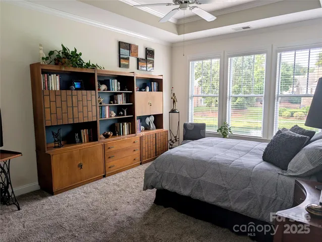a bedroom with a bed furniture and a window