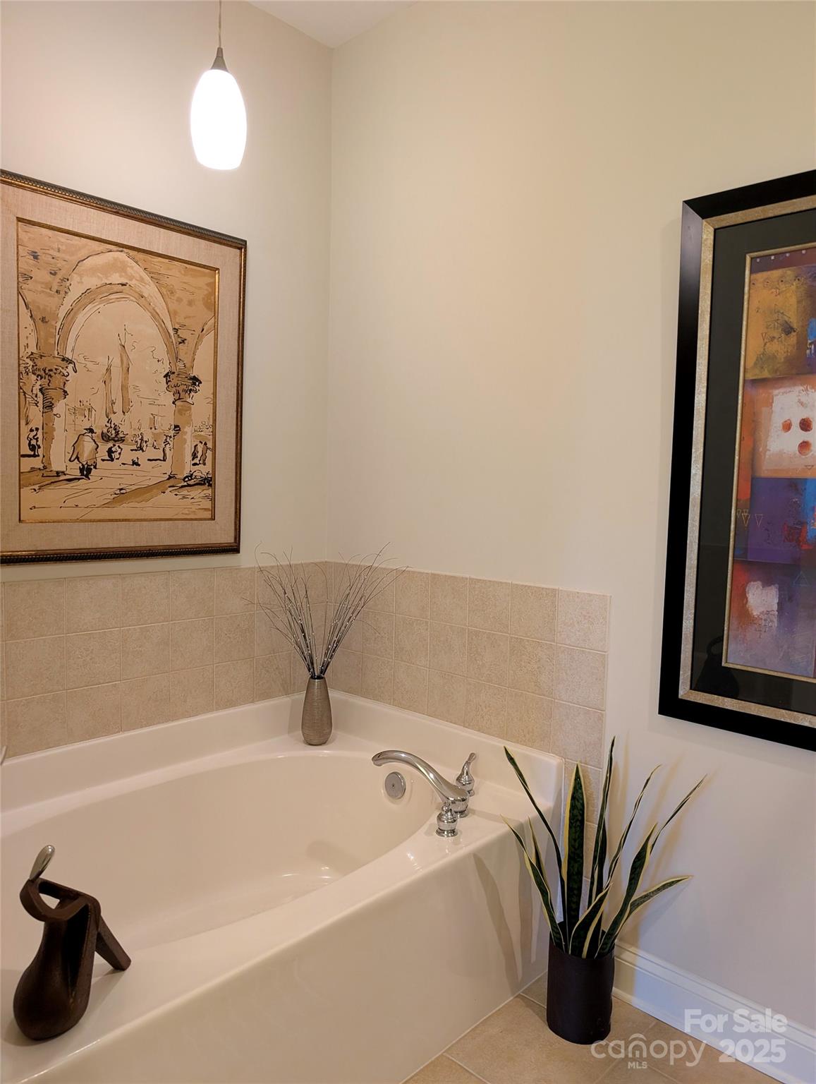 2666 Bellasera Way Matthews, NC 28105 - Photo 15 of 31 a bathroom with a tub and a shower