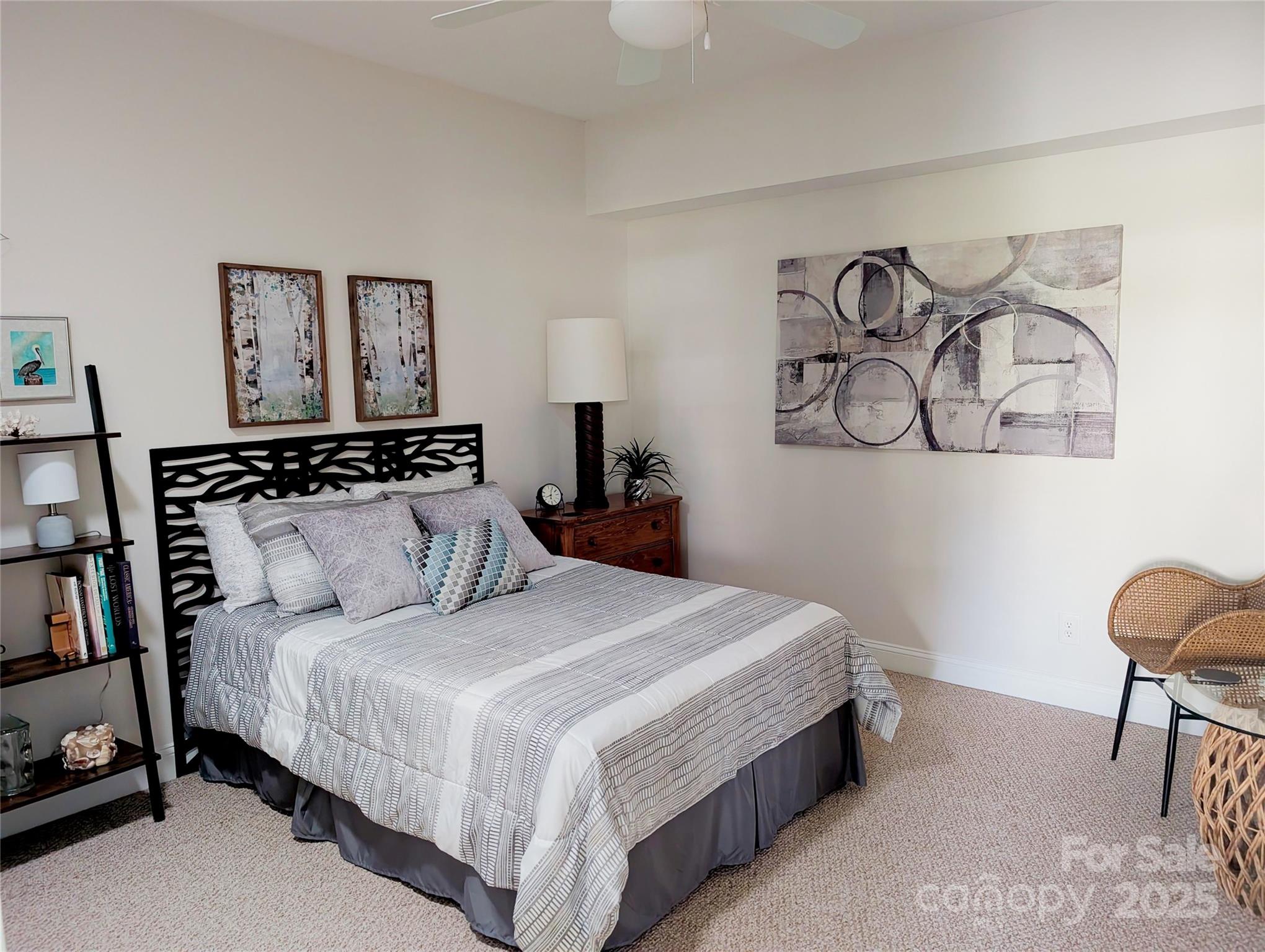 2666 Bellasera Way Matthews, NC 28105 - Photo 24 of 31 a bedroom with a bed and painting on the wall