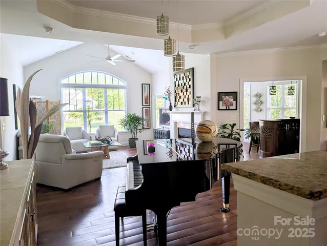 a living room with fireplace furniture and a window