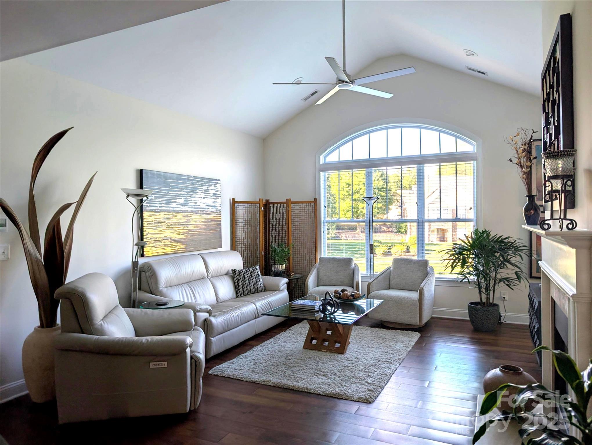 2666 Bellasera Way Matthews, NC 28105 - Photo 5 of 31 a living room with furniture fireplace and a large window