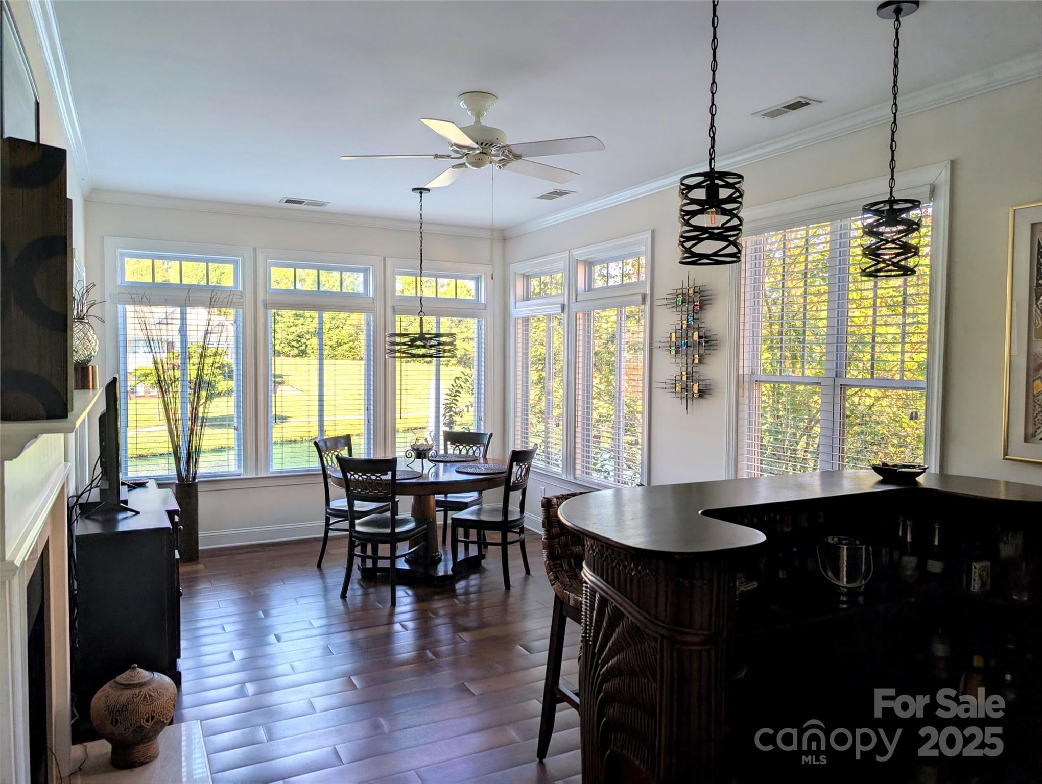 2666 Bellasera Way Matthews, NC 28105 - Photo 8 of 31 a view of a dining room with furniture window and wooden floor