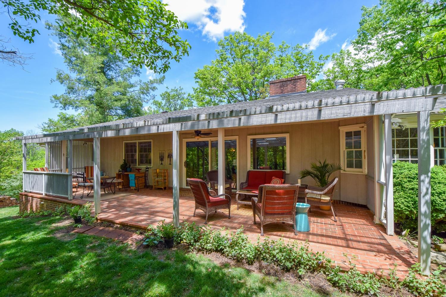 5105 Falcon Ridge Road Roanoke, VA 24018 - Photo 3 of 32 a view of a house with backyard sitting area and garden