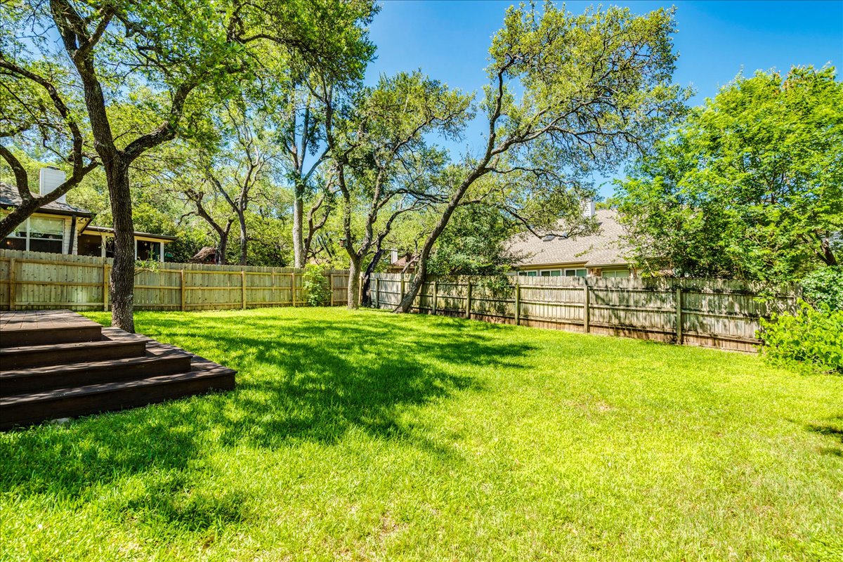 6530 Needham Lane Austin, TX 78739 - Photo 27 of 29 A spacious, naturally illuminated backyard provides abundant outdoor living and entertaining possibilities.