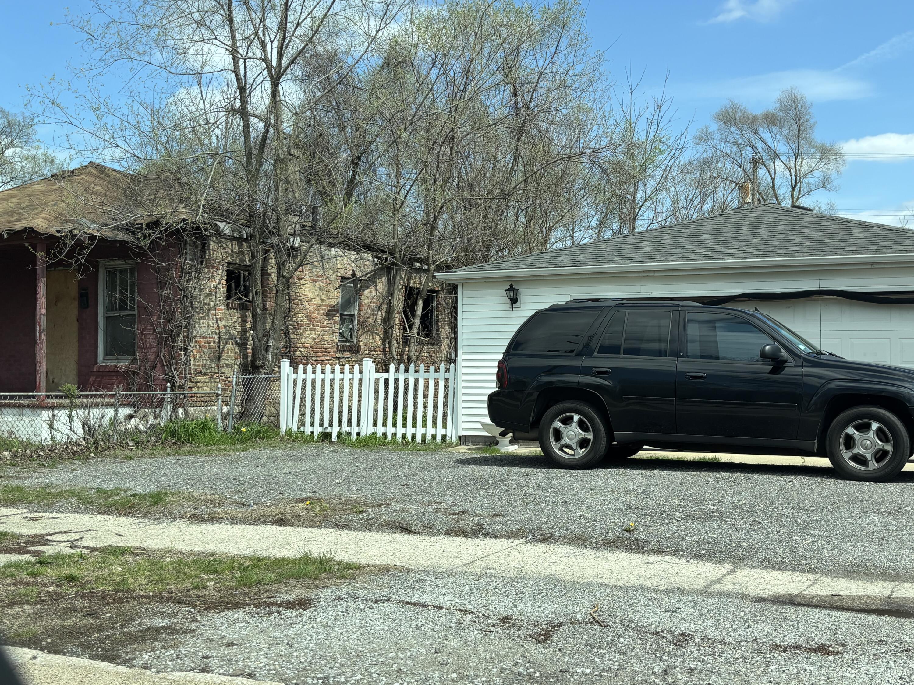 2461 Delaware Street Gary, IN 46407 - Photo 2 of 2 a car parked in front of a house