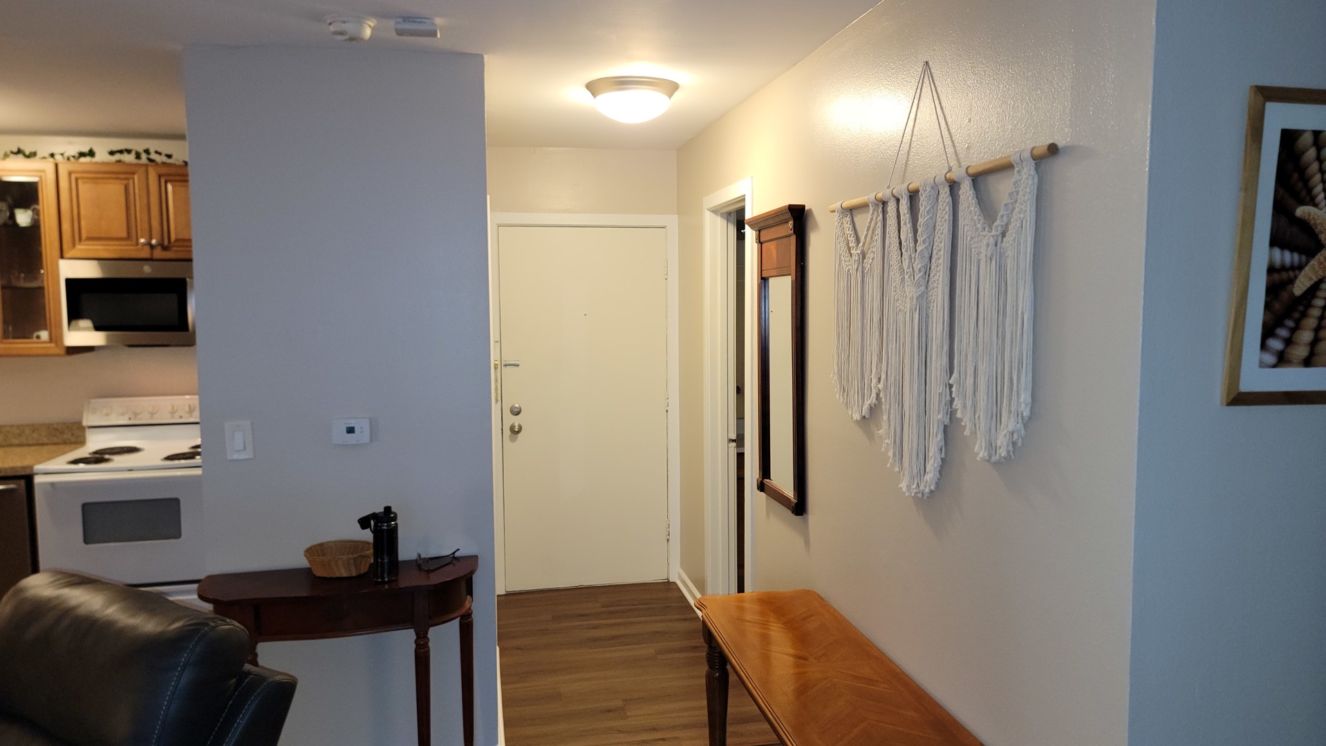 1810 Hemlock Place, Unit 209 Schaumburg, IL 60173 - Photo 4 of 13 a view of a hallway with workspace and a window