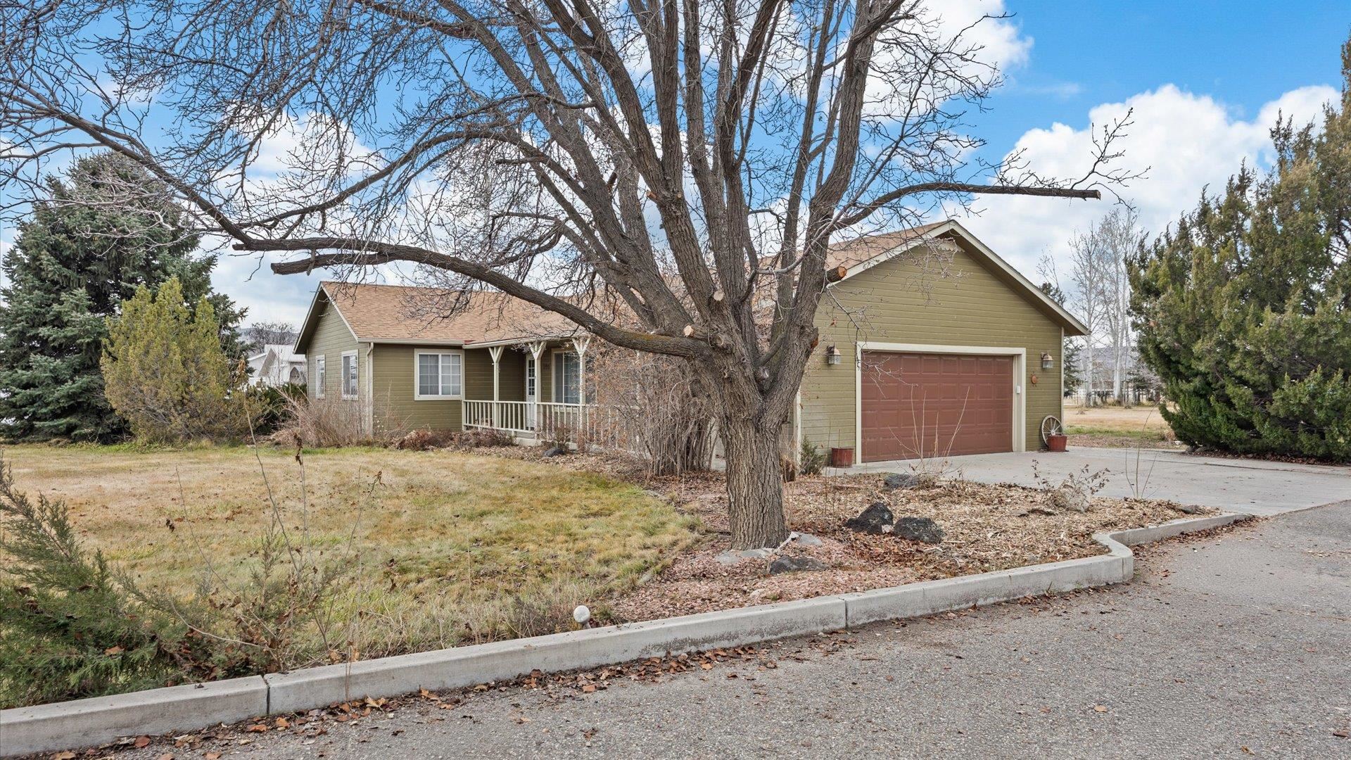 1195-17 1/2 North 1/2 Road Fruita, CO 81521 - Photo 3 of 33 a front view of a house with a yard covered with snow