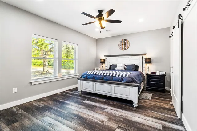 a large kitchen with stainless steel appliances granite countertop a sink and a stove