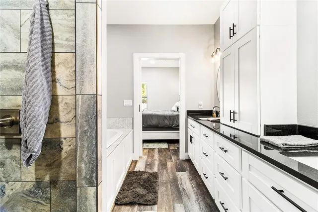 a bathroom with a double vanity sink and a mirror