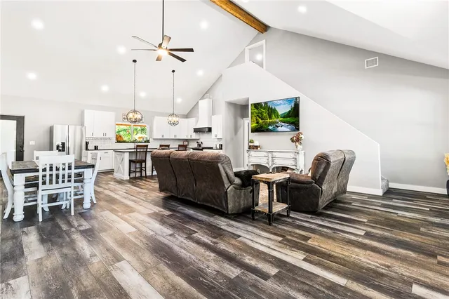 a large kitchen with a table and chairs in it