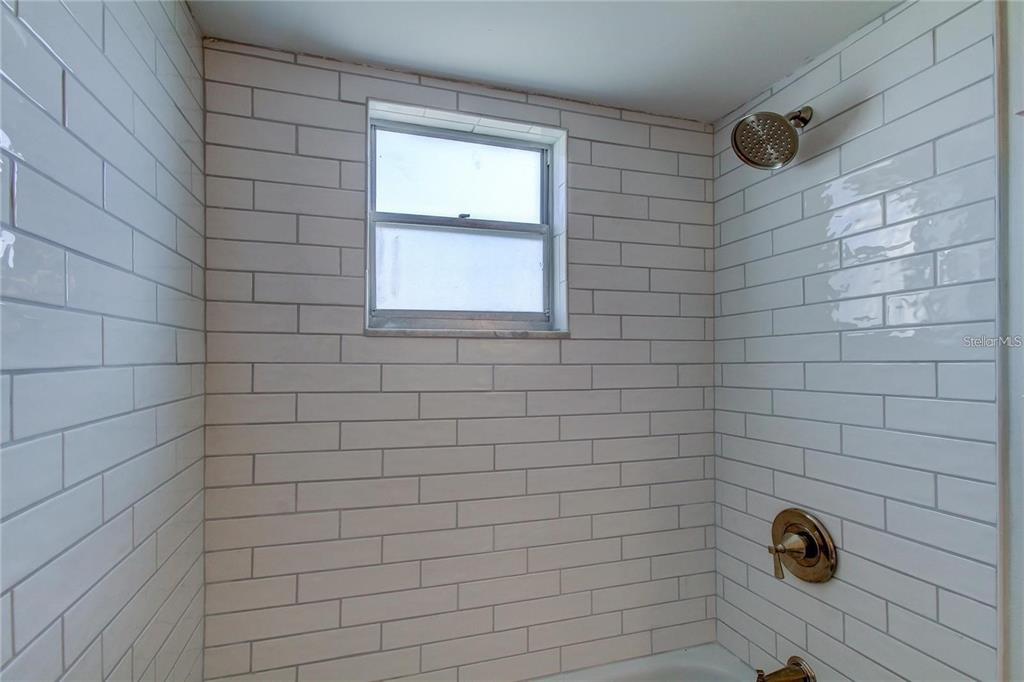 4901 Onyx Lane, Unit 204 New Port Richey, FL 34652 - Photo 21 of 46 a bathroom with a shower