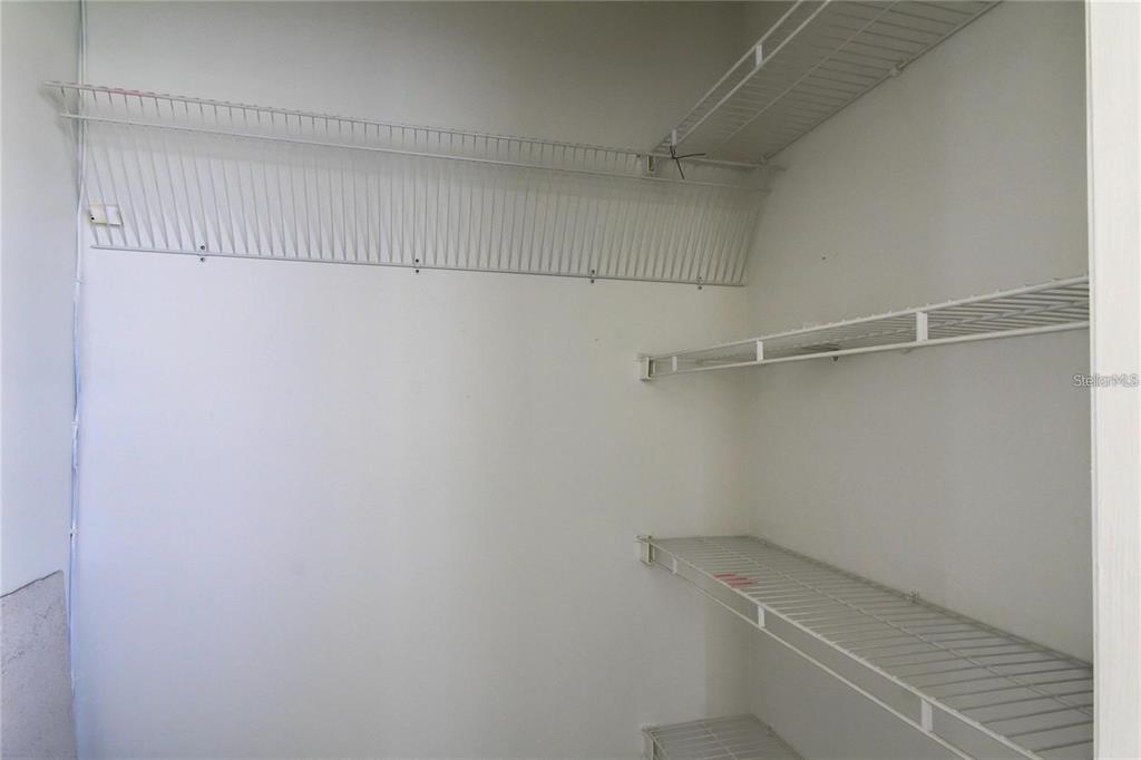 4901 Onyx Lane, Unit 204 New Port Richey, FL 34652 - Photo 22 of 46 a view of a room with racks on the wall
