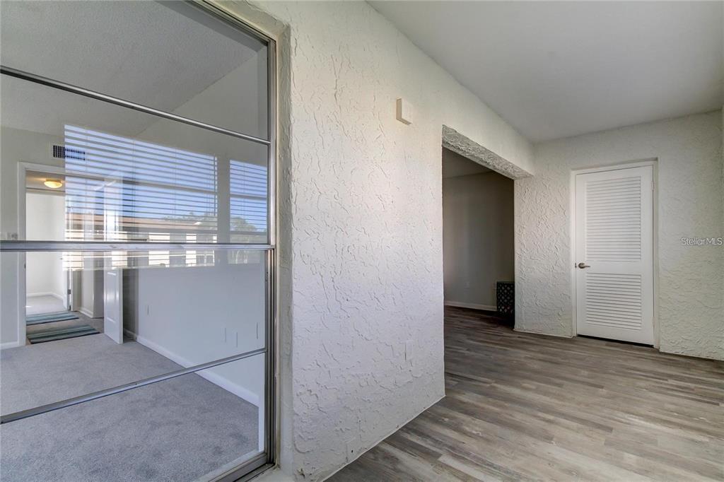 4901 Onyx Lane, Unit 204 New Port Richey, FL 34652 - Photo 23 of 46 a view of hallway with wooden floor