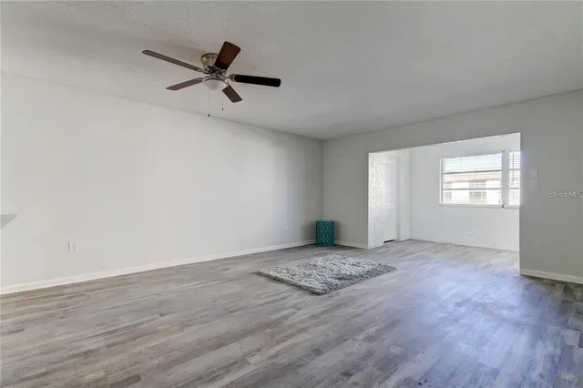 a view of a kitchen cabinets and wooden floor