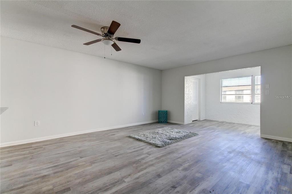 4901 Onyx Lane, Unit 204 New Port Richey, FL 34652 - Photo 29 of 46 a view of a room with wooden floor and windows
