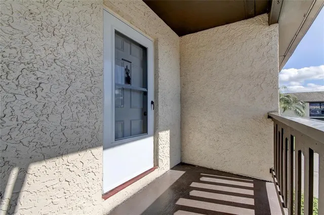 an aerial view of a house with garden space and street view