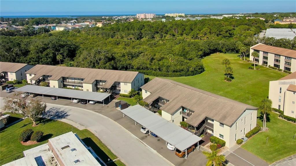 4901 Onyx Lane, Unit 204 New Port Richey, FL 34652 - Photo 35 of 46 an aerial view of a house with garden space and street view