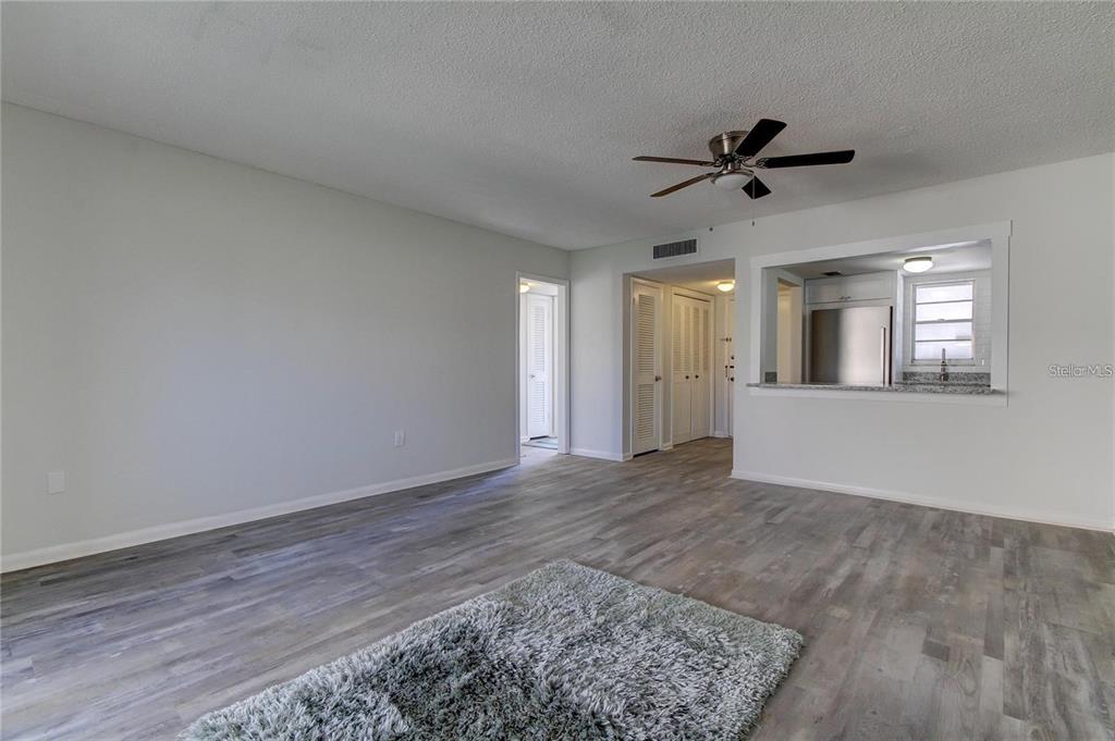 4901 Onyx Lane, Unit 204 New Port Richey, FL 34652 - Photo 4 of 46 a view of a big room with wooden floor and windows
