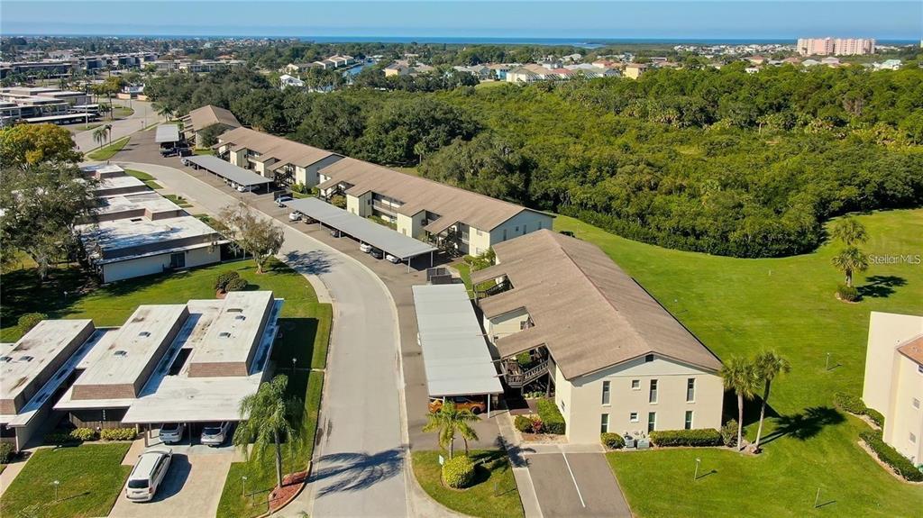 4901 Onyx Lane, Unit 204 New Port Richey, FL 34652 - Photo 43 of 46 an aerial view of a house with garden space and street view