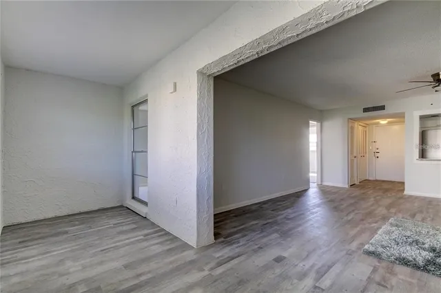 a kitchen with stainless steel appliances granite countertop a stove and a microwave