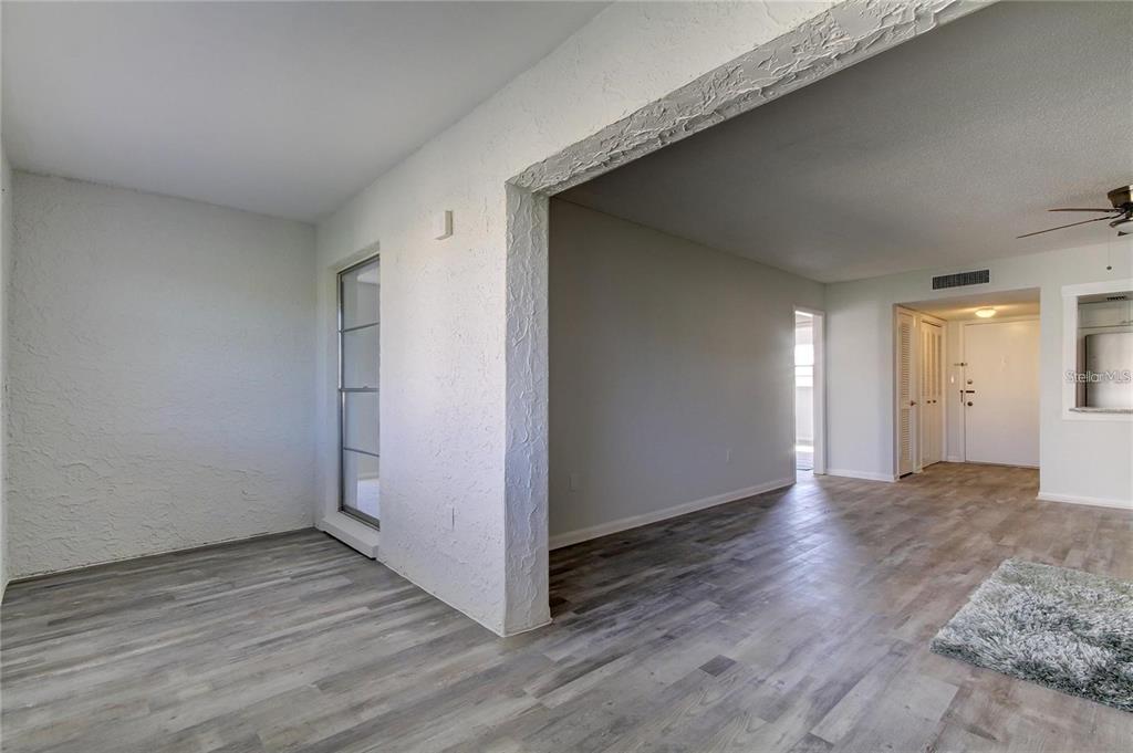 4901 Onyx Lane, Unit 204 New Port Richey, FL 34652 - Photo 6 of 46 a view of an empty room with wooden floor and closet