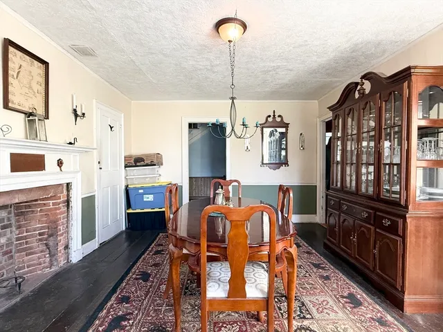 a view of living room with furniture and fireplace