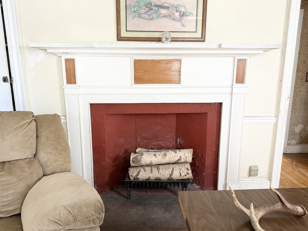334 Elm Street West Springfield, MA 01089 - Photo 22 of 42 a living room with furniture and a fireplace