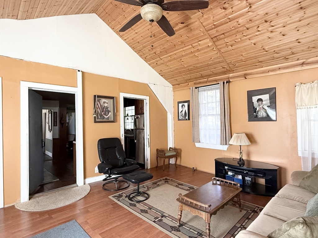 334 Elm Street West Springfield, MA 01089 - Photo 28 of 42 a living room with furniture a wooden floor and next to a window