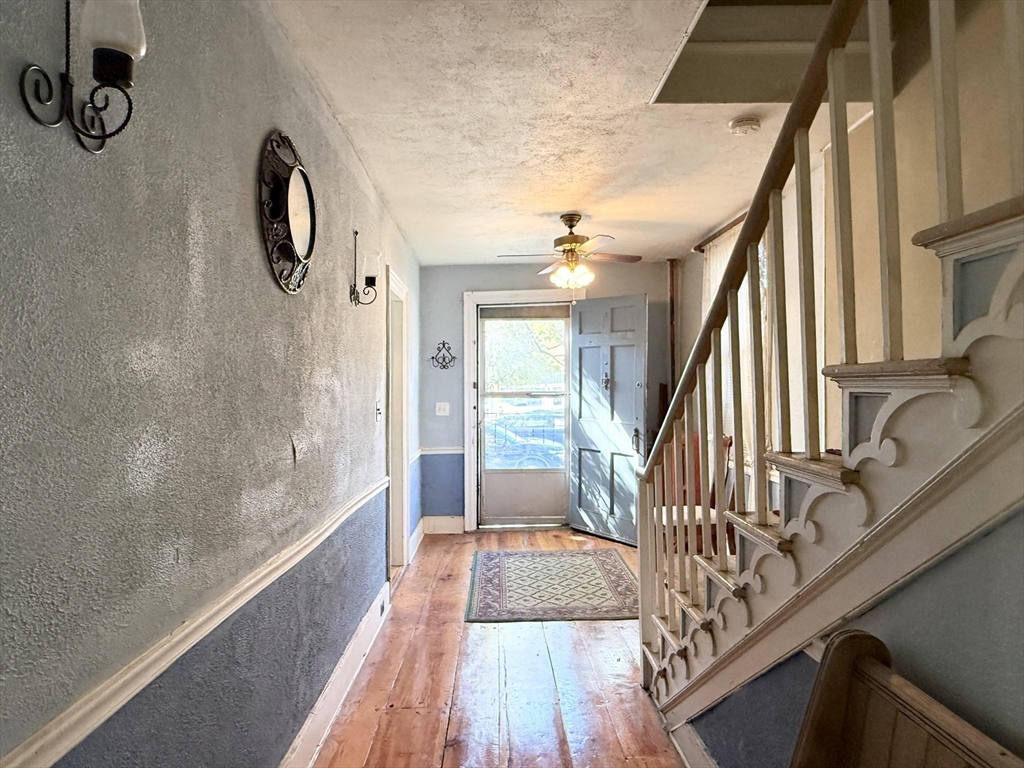 334 Elm Street West Springfield, MA 01089 - Photo 29 of 42 a view of a hallway with wooden floor and staircase