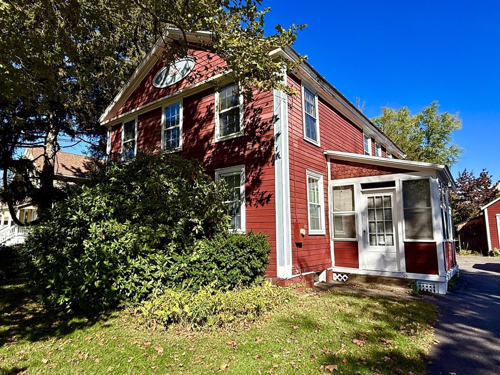 334 Elm Street West Springfield, MA 01089 - Photo 4 of 42 front view of a house with a small yard